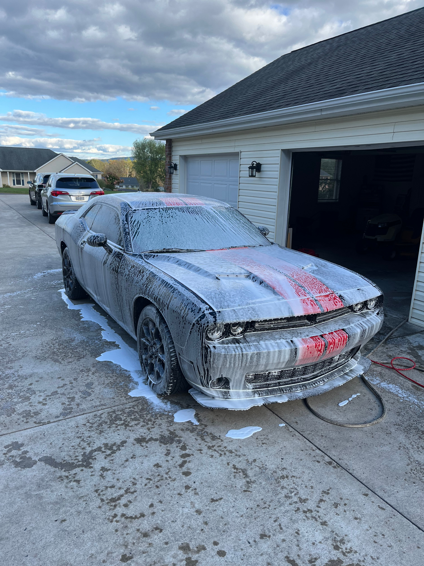Dodge Challenger covered in foam during exterior wash
